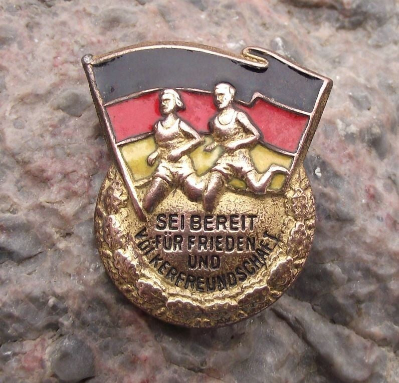 Vintage East Germany Ready for Peace & Friendship Running DDR Flag Pin Badge - Badgecrazy