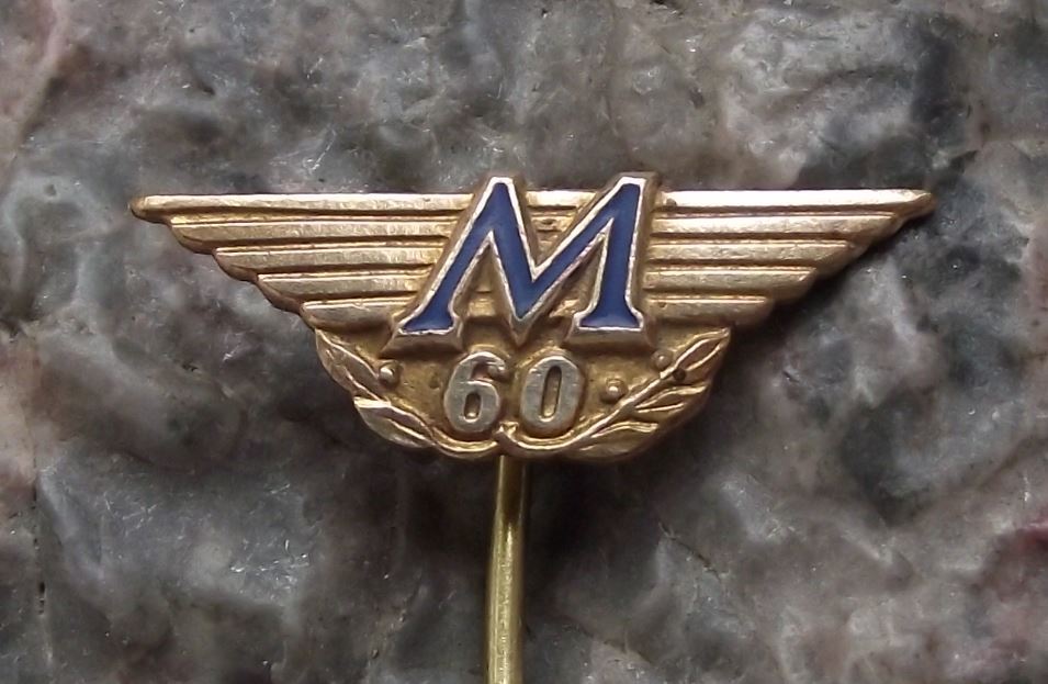 1971 Winged Flying Letter M 60 Logo Safety Match Maker Matchboxes Pin Badge - Badgecrazy
