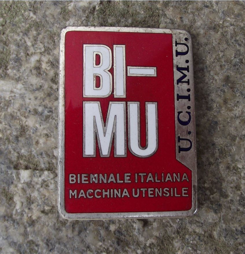 BI-MU UCIMU Biennale Italiana Macchina Utensile Machine Robot Expo Pin Badge - Badgecrazy