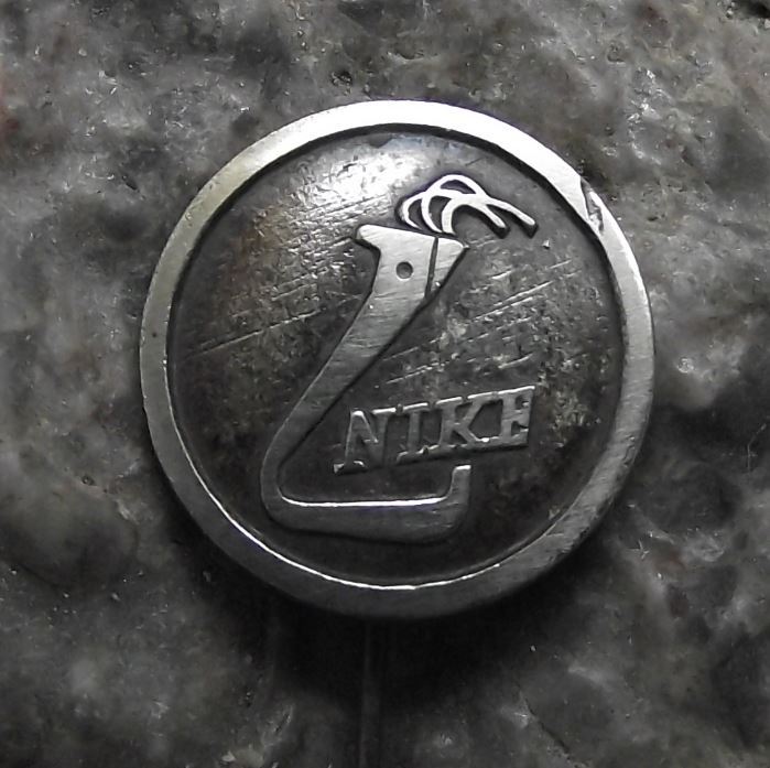 Nike Flaming Torch Fire Company Logo Pin Badge - Badgecrazy