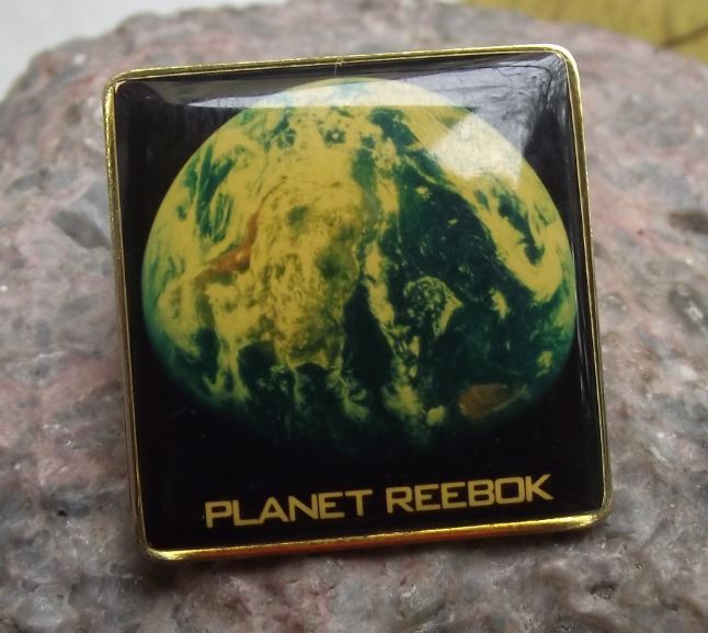 1990s Planet Reebok Shoes Sports Clothing Equipment Advertising Pin Badge - Badgecrazy